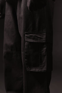 Dark pants with a pocket on a black background